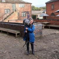 Sound artist Dr Brona Martin in the Erddig stable yard